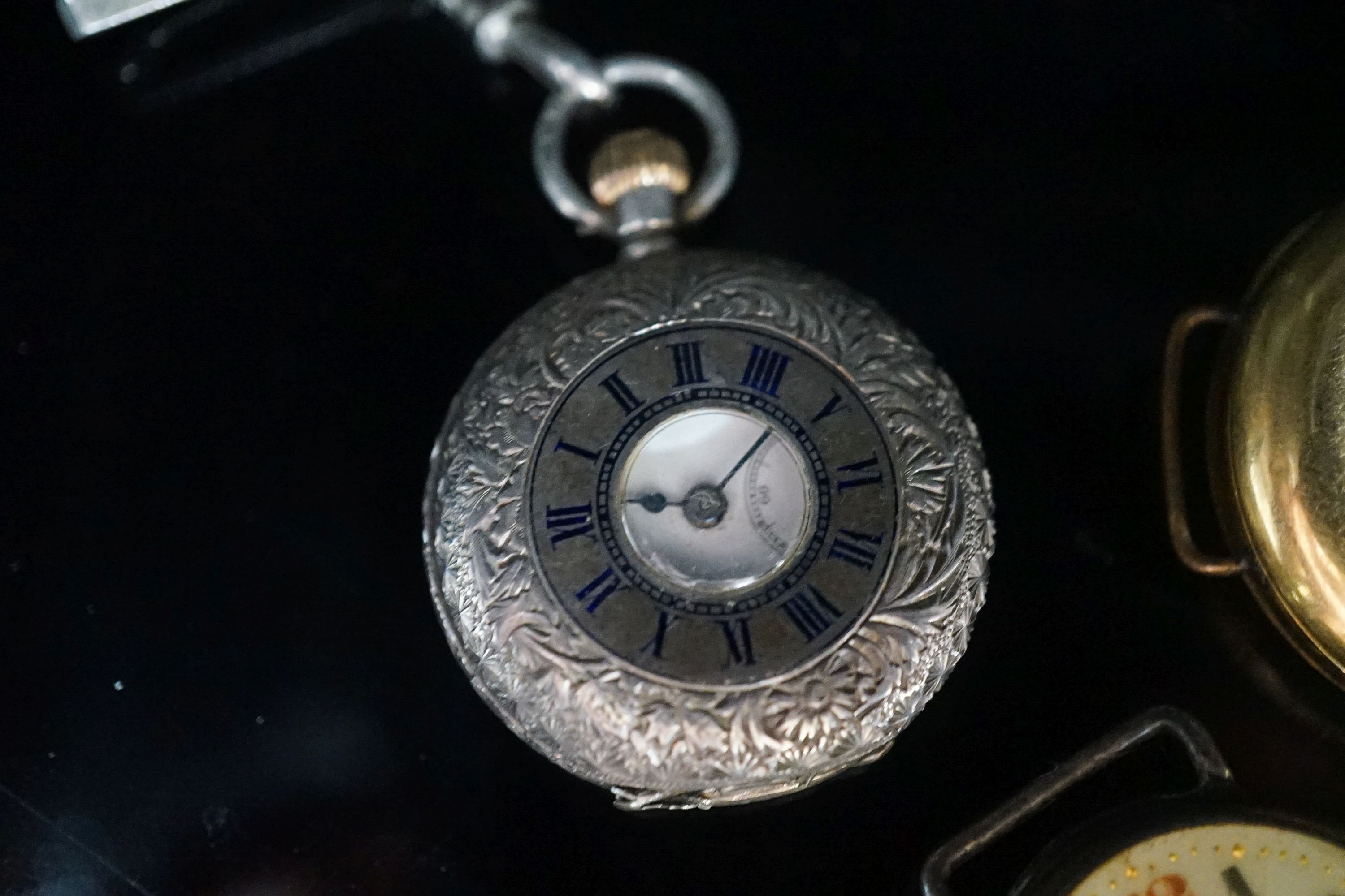 A gentleman's early 20th century continental 18k half hunter wrist watch, case diameter 33mm, gross weight 32.7 grams, together with two other silver watches.